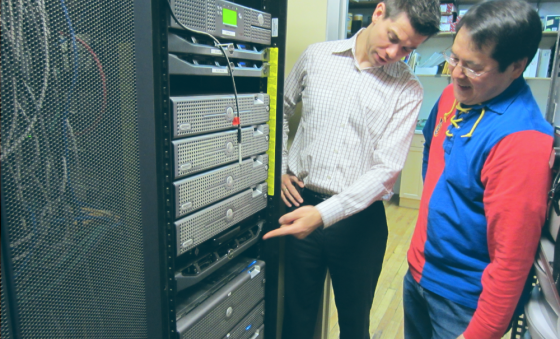 Two men inspecting a data center